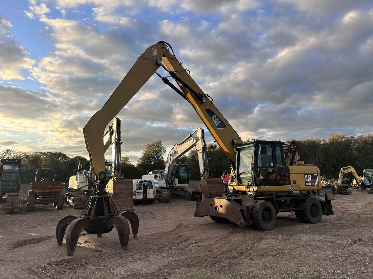 CATERPILLAR M 318 MH mit Greifer Kein 3022 3026 320 322 - Excavadora de ruedas: foto 1 CATERPILLAR M 318 MH mit Greifer Kein 3022 3026 320 322 - Excavadora de ruedas: foto 1