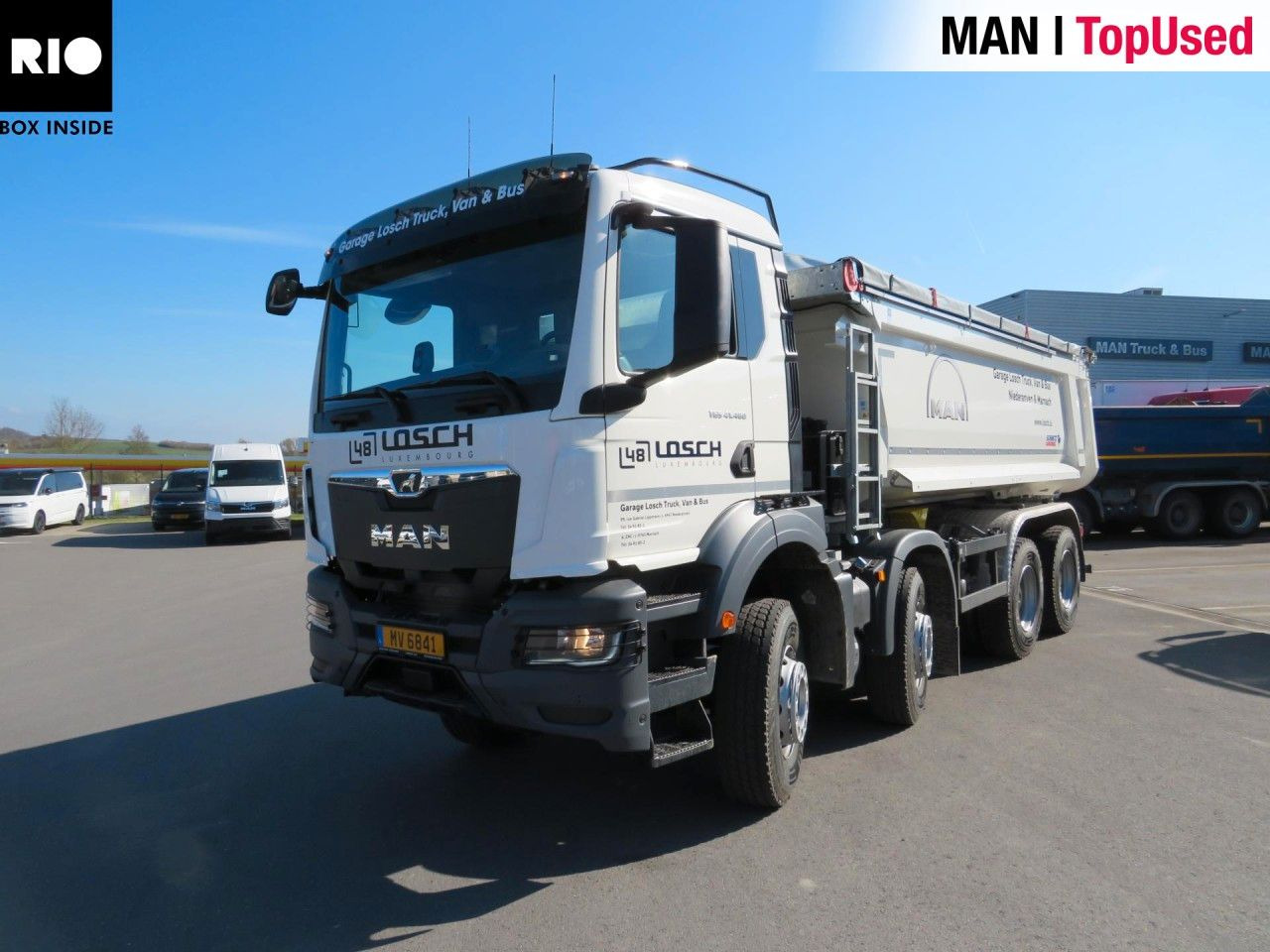 MAN TGS 41.480 8x4 BB CH Schmitz Muldenkipper - Camión portacontenedor de cadenas: foto 1 MAN TGS 41.480 8x4 BB CH Schmitz Muldenkipper - Camión portacontenedor de cadenas: foto 1