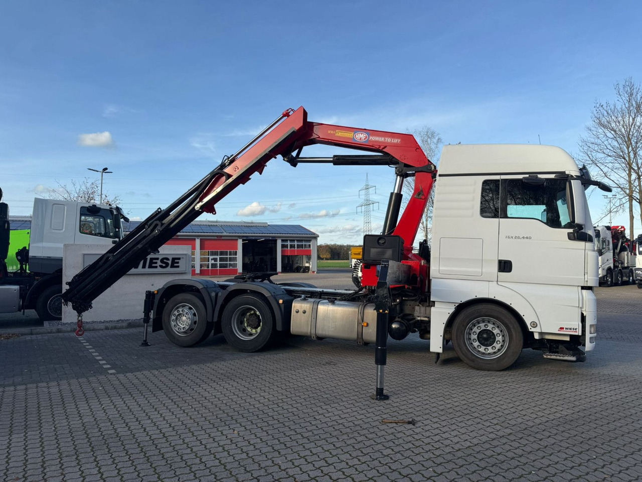 MAN TGX 26.440 6x2 mit HMF 3000-K5 Kran Top Zustand - Cabeza tractora: foto 1 MAN TGX 26.440 6x2 mit HMF 3000-K5 Kran Top Zustand - Cabeza tractora: foto 1