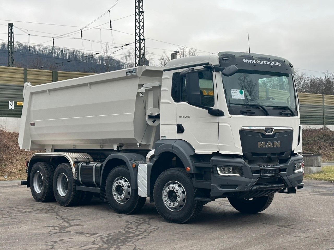 MAN TGS 41.400 8x4 / EUROMIX MTP 20m³/ EURO 5 - Camión portacontenedor de cadenas: foto 1 MAN TGS 41.400 8x4 / EUROMIX MTP 20m³/ EURO 5 - Camión portacontenedor de cadenas: foto 1