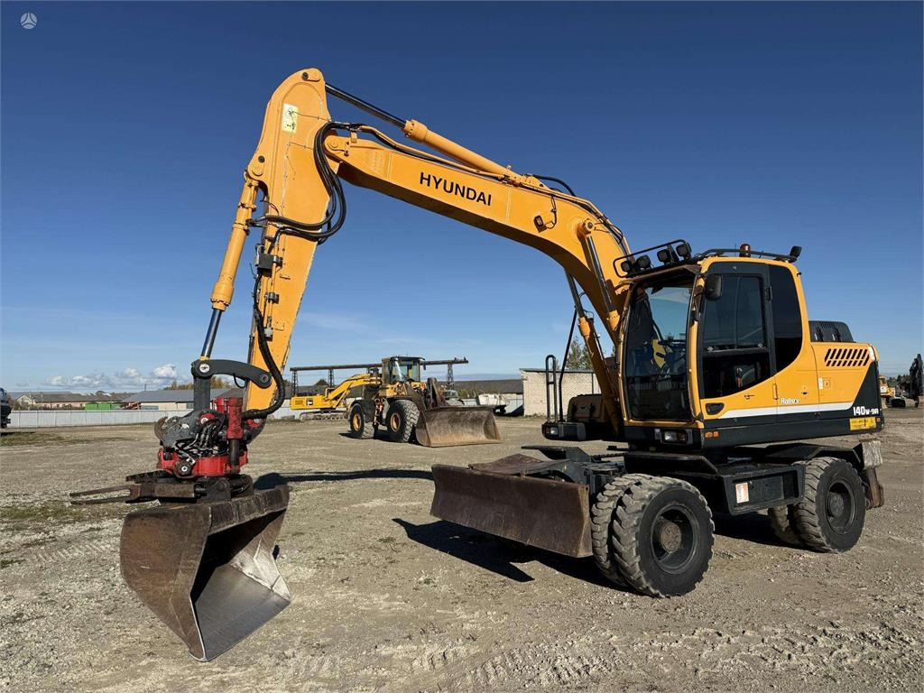 Hyundai Robex 140 W-9A Rototilt + grap - Excavadora de ruedas: foto 1 Hyundai Robex 140 W-9A Rototilt + grap - Excavadora de ruedas: foto 1
