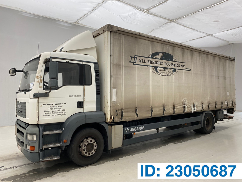 MAN TGA 18.320 - Camión lona: foto 1 MAN TGA 18.320 - Camión lona: foto 1