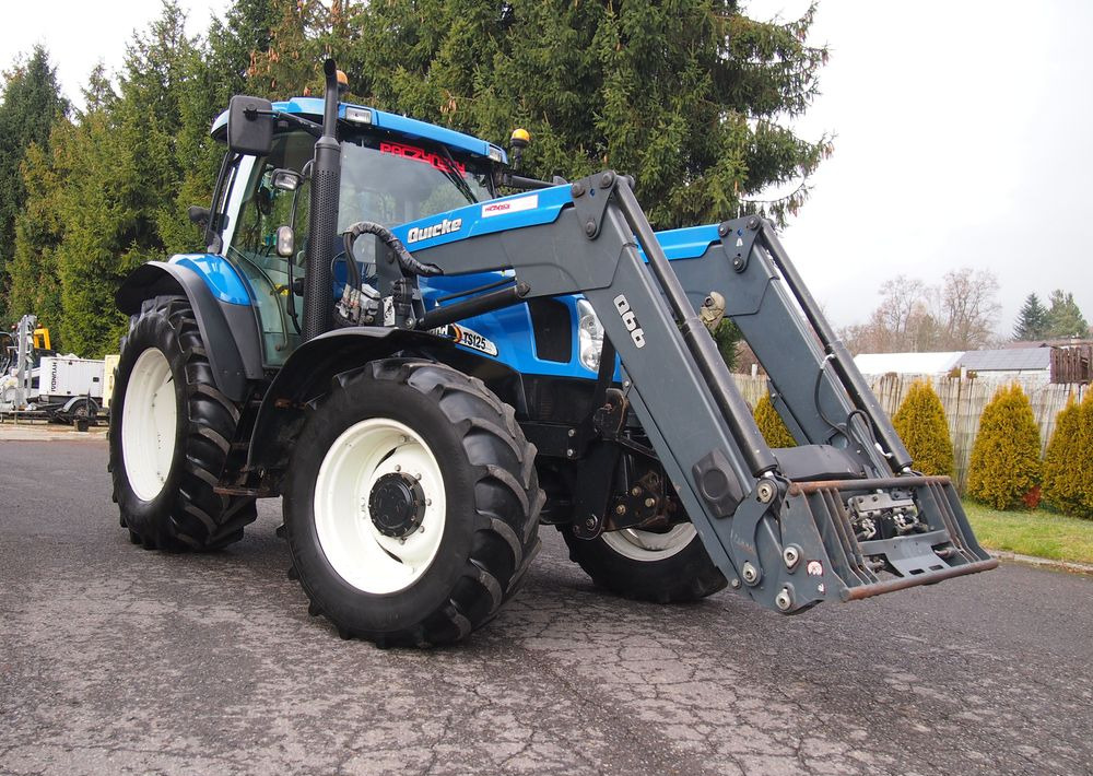 Ciągnik New Holland NH TS125A 6 cylindrów 2004 Ciągnik rolniczy New Holland TS125A - Tractor: foto 2 Ciągnik New Holland NH TS125A 6 cylindrów 2004 Ciągnik rolniczy New Holland TS125A - Tractor: foto 2