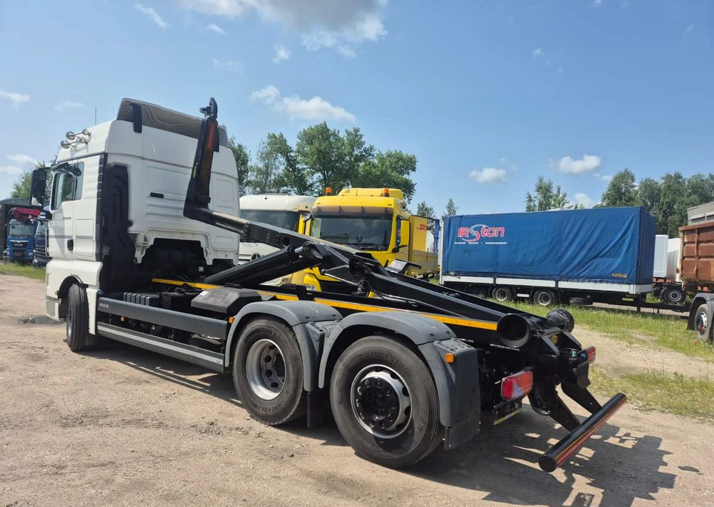 MAN TGX 26-460 Hakowiec oś skrętna - Camión multibasculante: foto 1 MAN TGX 26-460 Hakowiec oś skrętna - Camión multibasculante: foto 1