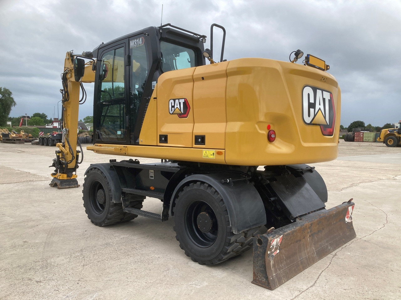 Excavadora de ruedas CATERPILLAR M314: foto 1