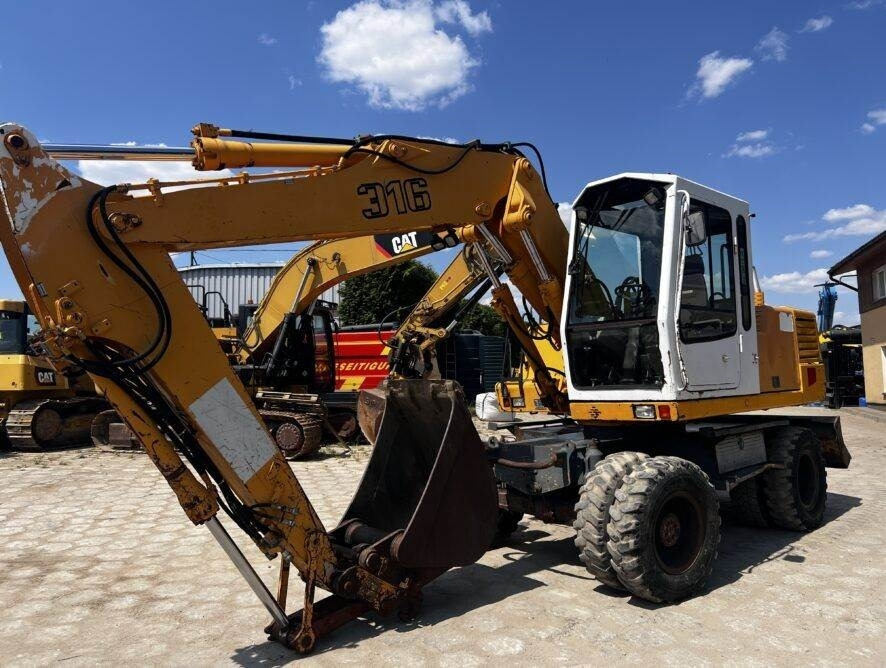Liebherr A316 - Excavadora de ruedas: foto 1 Liebherr A316 - Excavadora de ruedas: foto 1