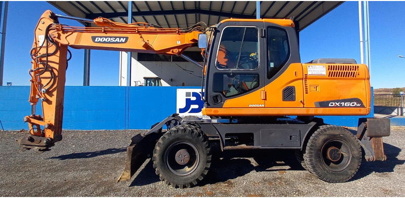 Doosan DX140W-3 - Excavadora de ruedas: foto 1 Doosan DX140W-3 - Excavadora de ruedas: foto 1
