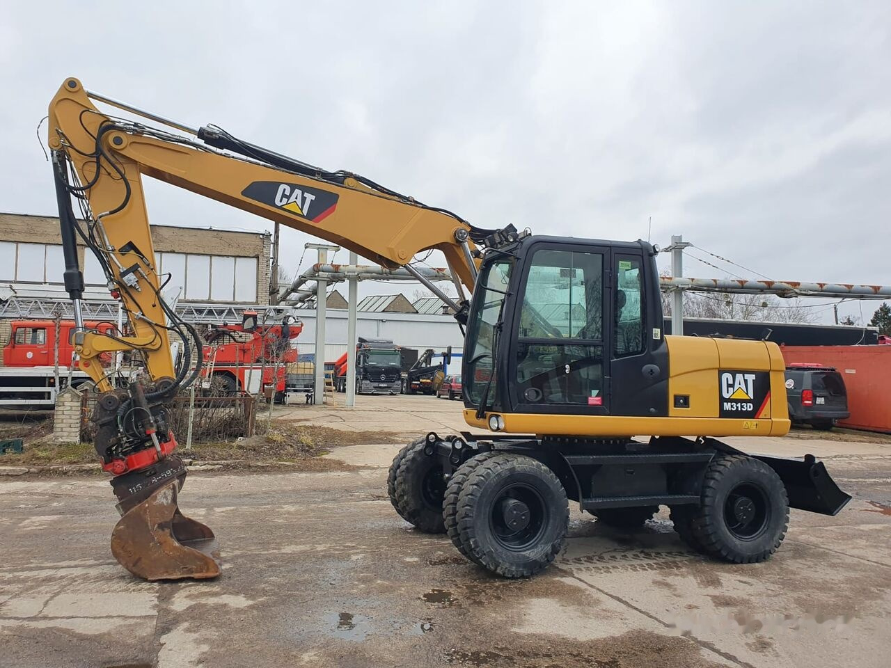 Caterpillar M 313 D Tiltrotator - Excavadora de ruedas: foto 2 Caterpillar M 313 D Tiltrotator - Excavadora de ruedas: foto 2