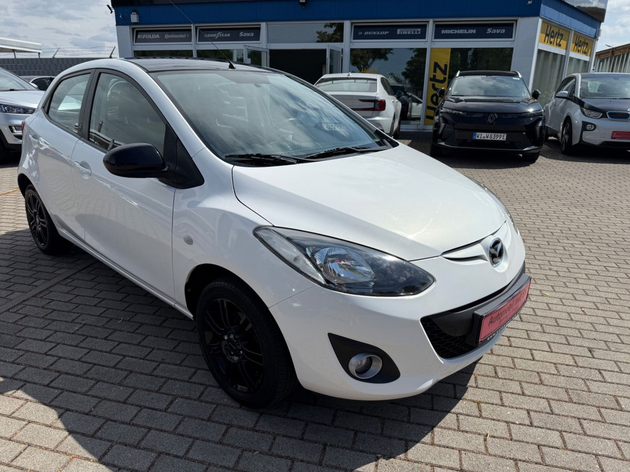 Mazda 2 Lim. 1.3 Origami 5 TÜER KLIMA SHZ TÜV NEU - Coche: foto 2 Mazda 2 Lim. 1.3 Origami 5 TÜER KLIMA SHZ TÜV NEU - Coche: foto 2