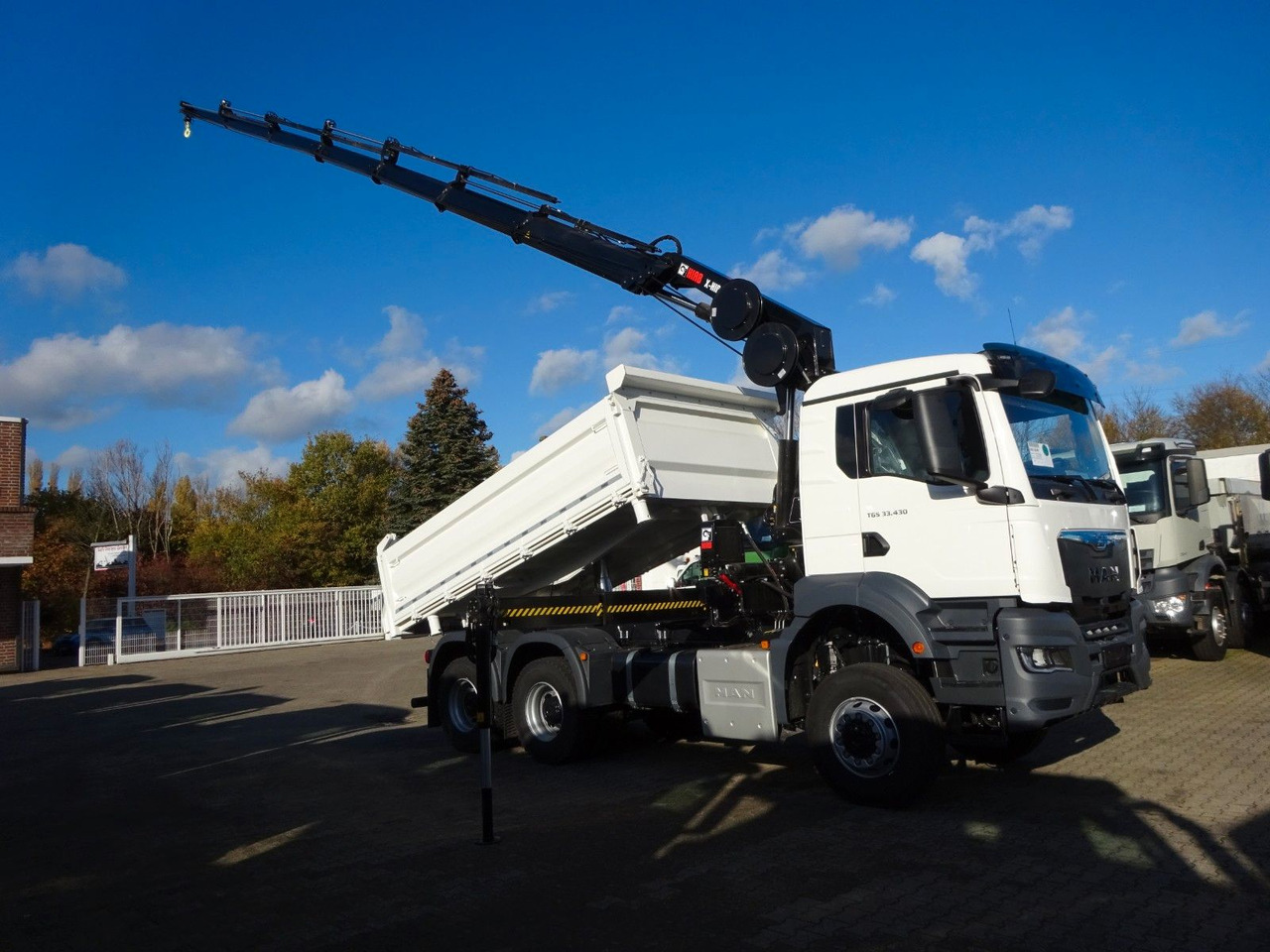 MAN 33.430 6x6 3-SEITENKIPPER KRAN HIAB 228- 6HYDRO - Camión volquete, Camión grúa: foto 1 MAN 33.430 6x6 3-SEITENKIPPER KRAN HIAB 228- 6HYDRO - Camión volquete, Camión grúa: foto 1