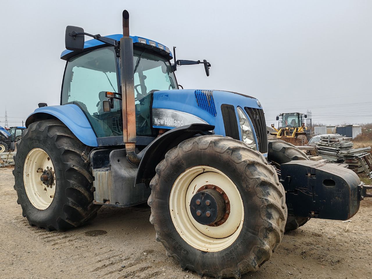 New Holland TG 255 - Tractor: foto 1 New Holland TG 255 - Tractor: foto 1