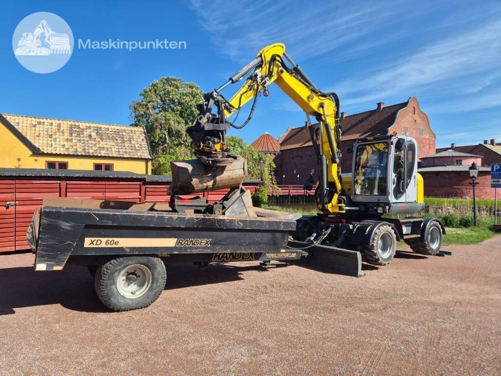 Wacker Neuson EW 100 med vagn - Excavadora de ruedas: foto 1 Wacker Neuson EW 100 med vagn - Excavadora de ruedas: foto 1