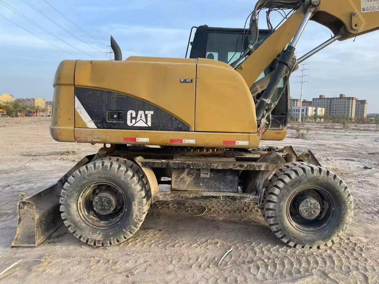 CATERPILLAR M315 - Excavadora de ruedas: foto 1 CATERPILLAR M315 - Excavadora de ruedas: foto 1