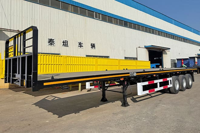 TITAN Tri Axle Flatbed Trailer for Sale in Jamaica - Semirremolque plataforma/ Caja abierta: foto 1 TITAN Tri Axle Flatbed Trailer for Sale in Jamaica - Semirremolque plataforma/ Caja abierta: foto 1