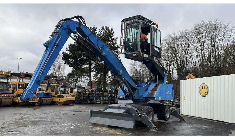 Fuchs MHL320 - Manipulador de materiales: foto 1 Fuchs MHL320 - Manipulador de materiales: foto 1