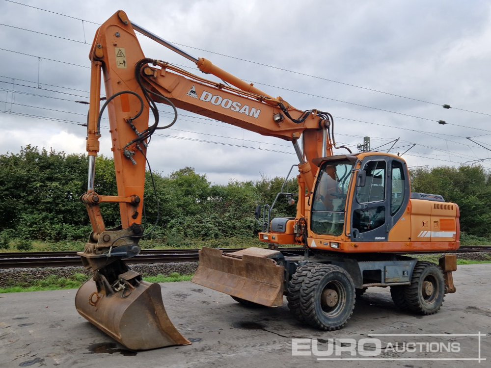 Doosan DX210W - Excavadora de ruedas: foto 1 Doosan DX210W - Excavadora de ruedas: foto 1