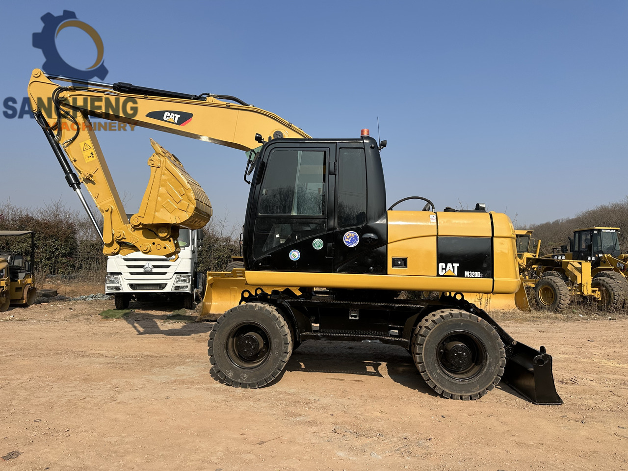 Excavadora de ruedas CATERPILLAR M320D2: foto 10